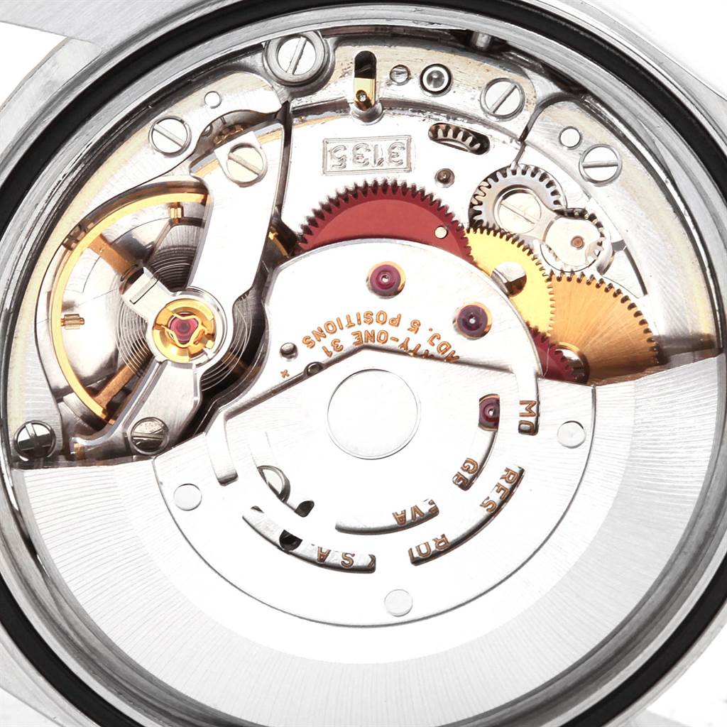 This image shows a close-up view of the Rolex Datejust 16233 Men's Steel and Gold (two tone) White Dial 16233 Men's Steel and Gold (two tone) White Dial movement, focusing on internal gears and components.