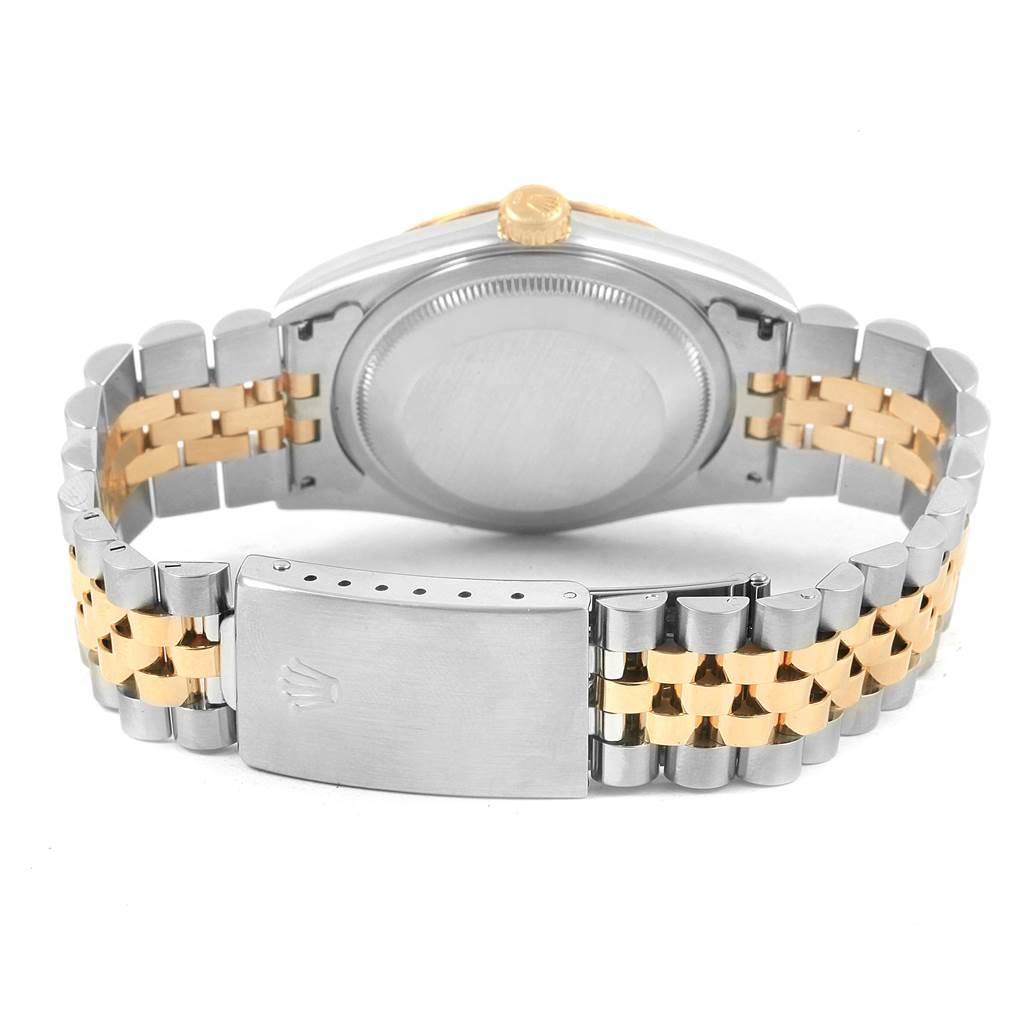 The image shows the back of a Rolex Datejust 16233 Men's Steel and Gold (two tone) Champagne Dial 16233 Men's Steel and Gold (two tone) Champagne Dial watch, highlighting the case back, crown, and jubilee bracelet with a deployment clasp.