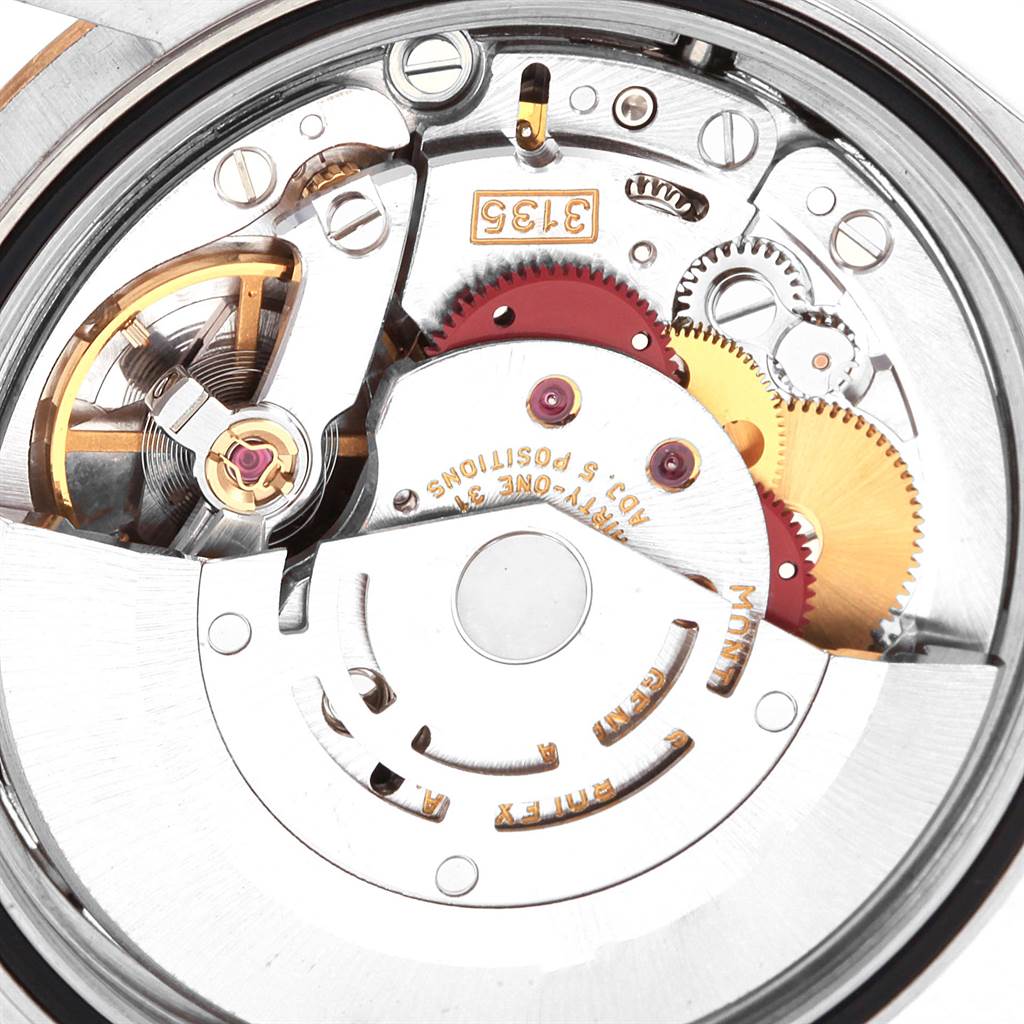 This image shows the internal mechanical movement of a Rolex Datejust 16233 Men's Steel and Gold (two tone) Champagne Dial 16233 Men's Steel and Gold (two tone) Champagne Dial watch, specifically its intricate gears and components.