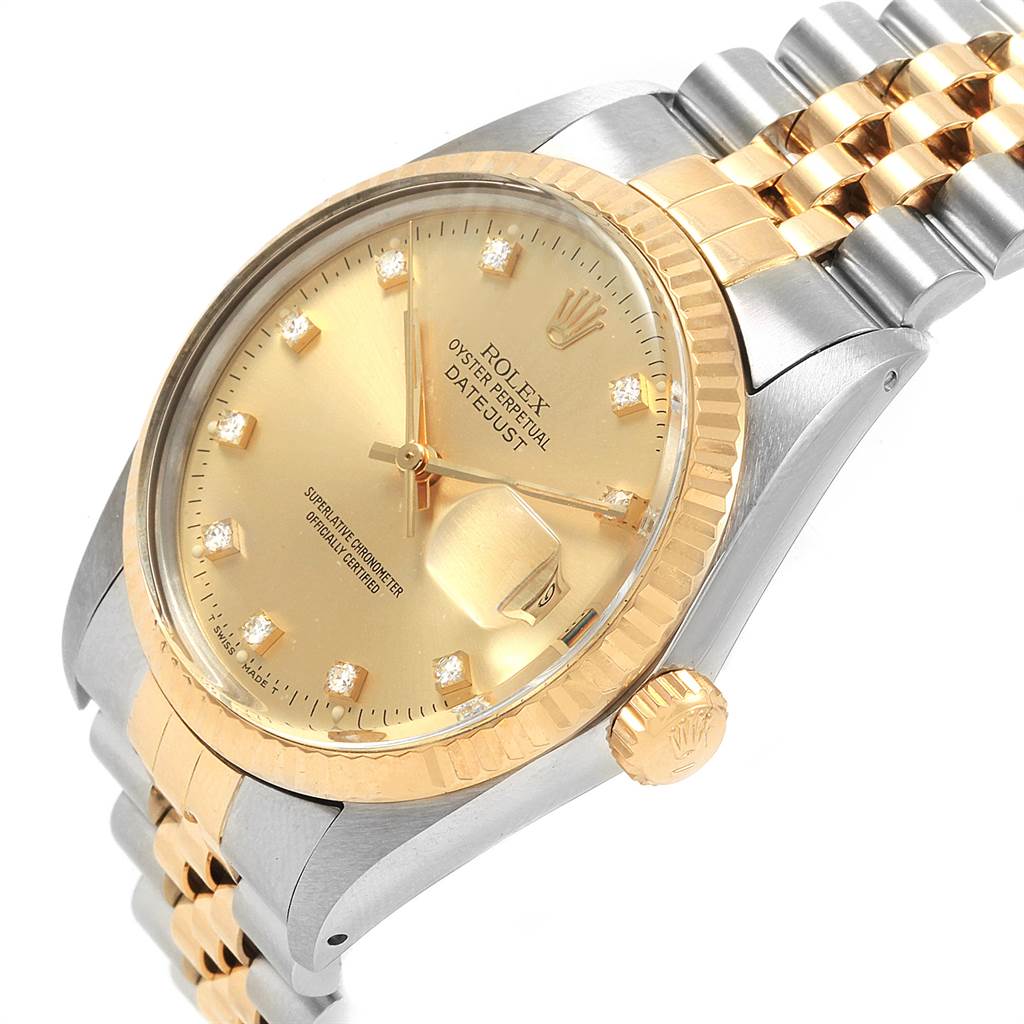 This image shows a close-up of the Rolex Datejust 16013 Men's Stainless Steel Champagne Dial 16013 Men's Stainless Steel Champagne Dial's dial, bezel, crown, and part of the bracelet at an angled view.