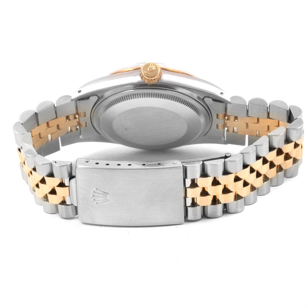 This is a rear view of the Rolex Datejust 16013 Men's Stainless Steel Champagne Dial 16013 Men's Stainless Steel Champagne Dial watch, showing the clasp, case back, and part of the two-tone bracelet.