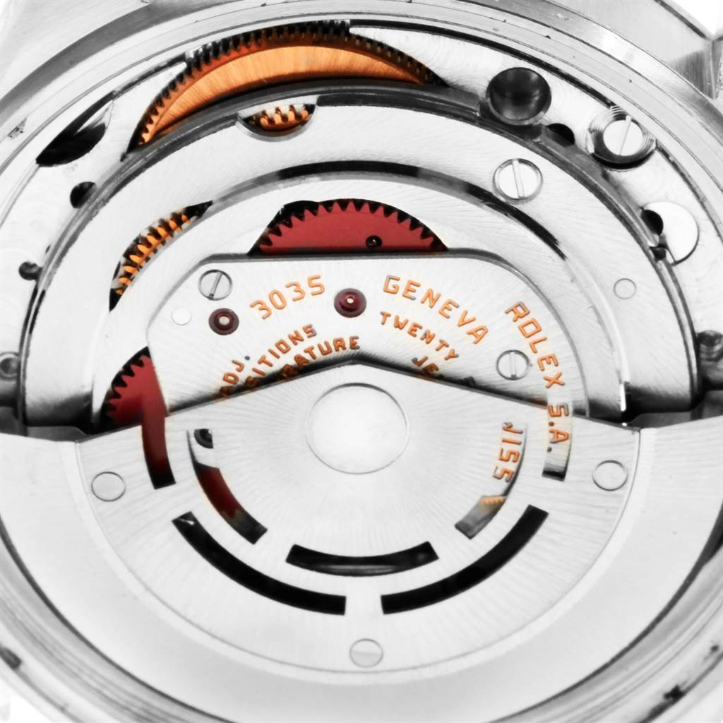 This close-up image shows the intricate inner workings of a Rolex Datejust 16013 Men's Stainless Steel Champagne Dial 16013 Men's Stainless Steel Champagne Dial model's movement.