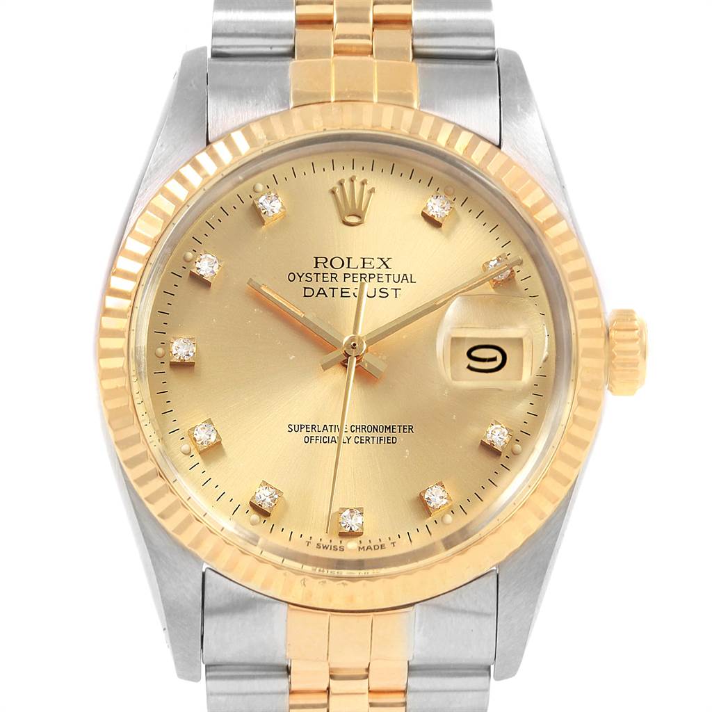This image shows a frontal view of the Rolex Datejust 16013 Men's Stainless Steel Champagne Dial 16013 Men's Stainless Steel Champagne Dial watch, highlighting its dial, bezel, and part of the bracelet.