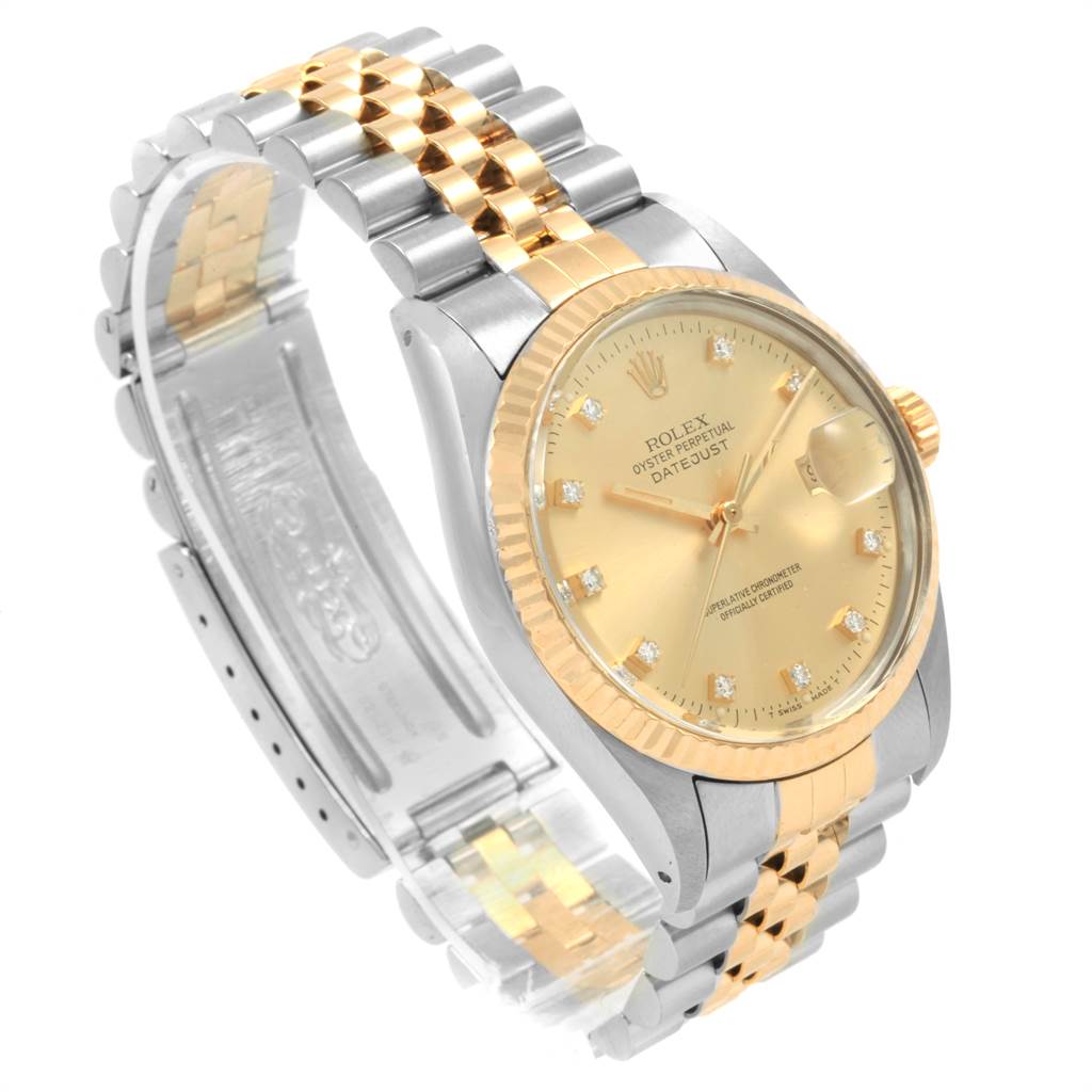 The Rolex Datejust 16013 Men's Stainless Steel Champagne Dial 16013 Men's Stainless Steel Champagne Dial watch is shown from an angle that highlights its dial, bezel, and two-tone bracelet.