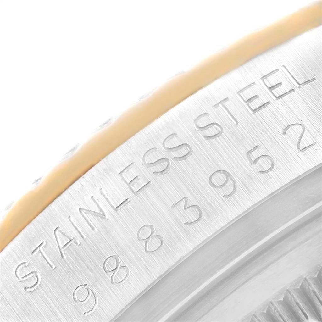 The image shows a close-up of the side of the Rolex Datejust 16013 Men's Stainless Steel Champagne Dial 16013 Men's Stainless Steel Champagne Dial watch, highlighting the stainless steel inscription and part of the bezel.