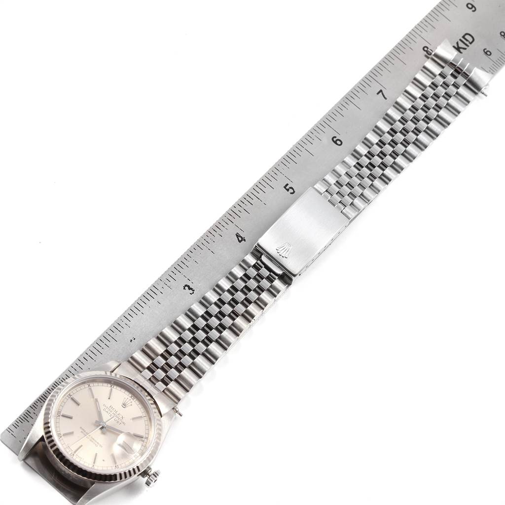 The image shows the face and the metal bracelet of a Rolex Datejust 16234 Men's Stainless Steel Silver Dial 16234 Men's Stainless Steel Silver Dial watch with a ruler for measurement.