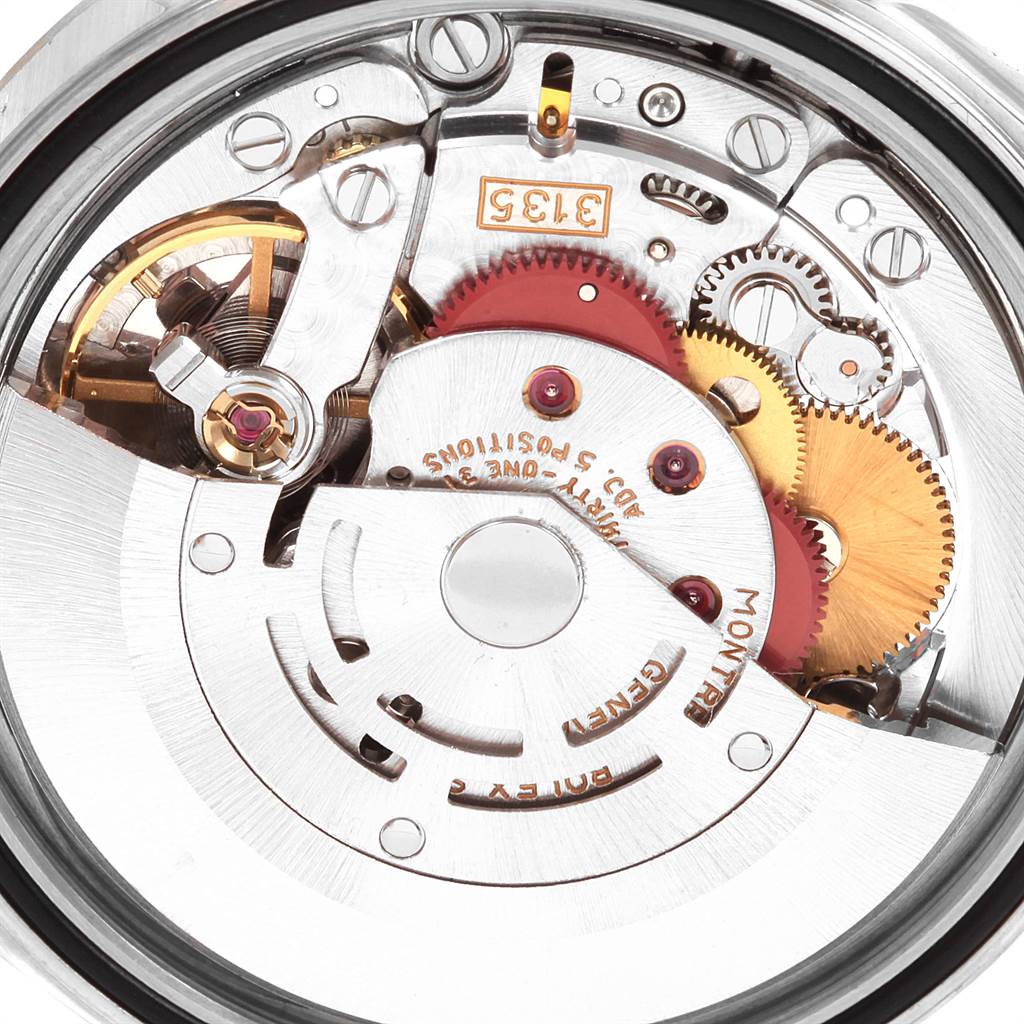 The image shows a close-up of the Rolex Datejust 16234 Men's Stainless Steel Silver Dial 16234 Men's Stainless Steel Silver Dial watch's internal movement, highlighting gears and intricate mechanical parts.