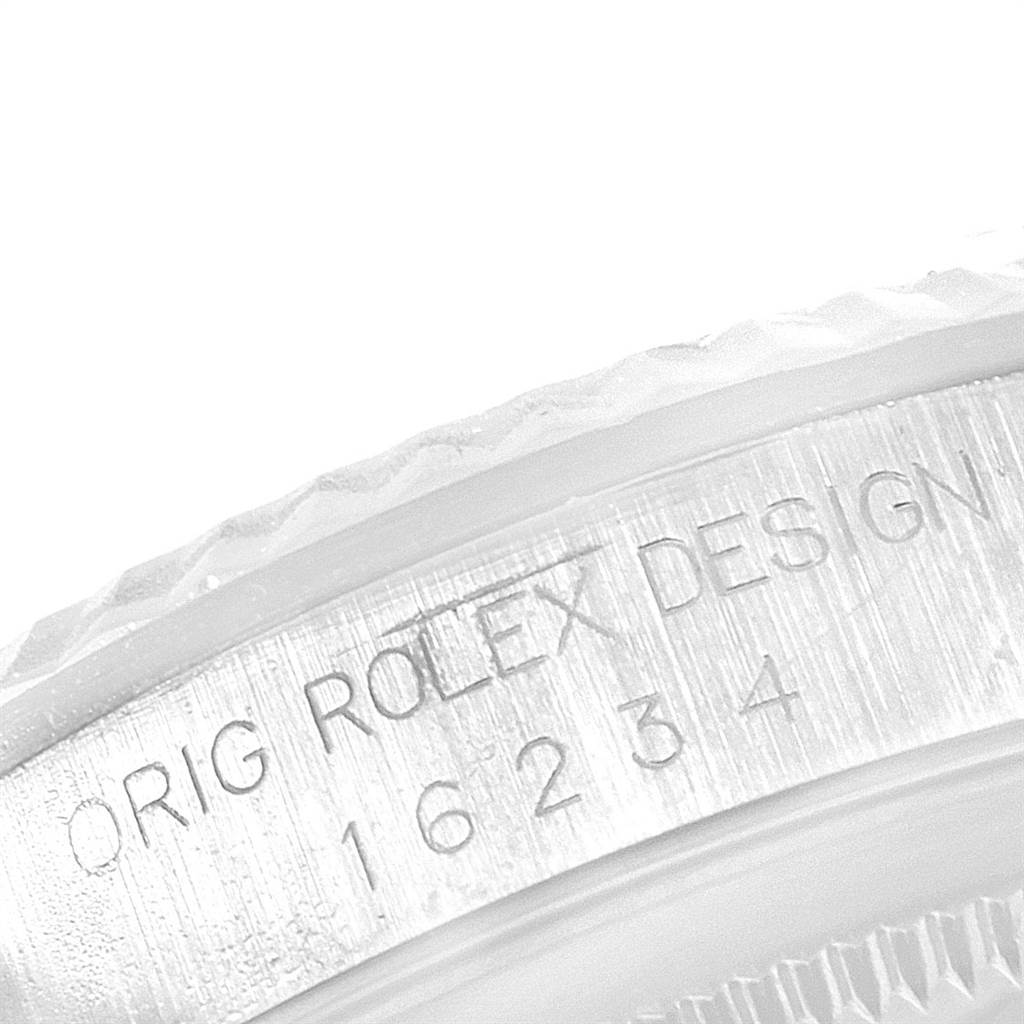 This image shows a close-up of the side of a Rolex Datejust 16234 Men's Stainless Steel Silver Dial 16234 Men's Stainless Steel Silver Dial watch, highlighting the "Orig Rolex Design" engraving and model number 16234.