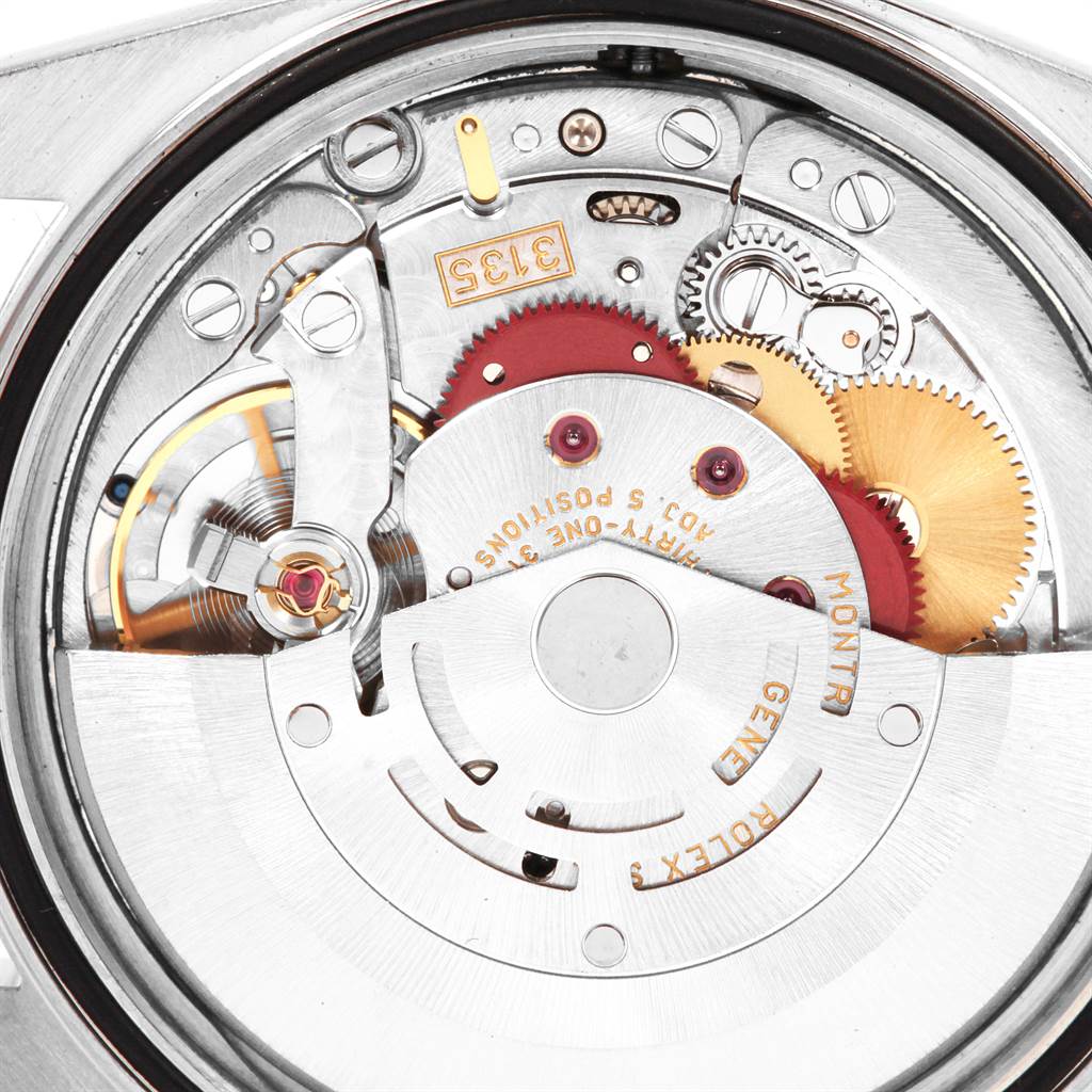 The image shows a close-up view of the internal mechanism of a Rolex Datejust 16234 Men's Stainless Steel Silver Dial 16234 Men's Stainless Steel Silver Dial watch, highlighting gears and components.