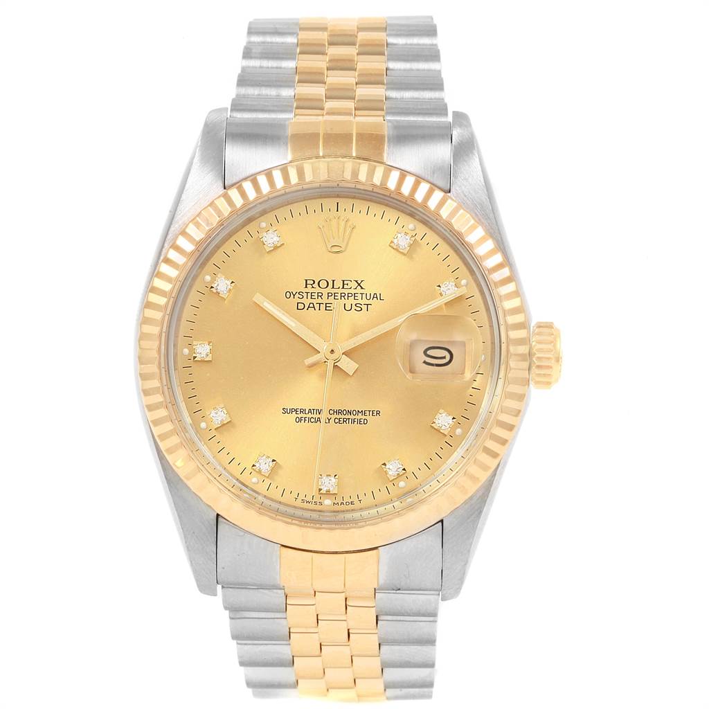 The image shows a Rolex Datejust 16013 Men's Stainless Steel Champagne Dial 16013 Men's Stainless Steel Champagne Dial watch from a top-down angle, featuring a gold bezel, champagne dial, and two-tone bracelet.