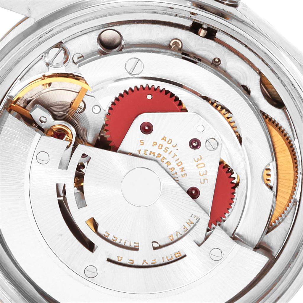 This image shows the intricate internal mechanism of the Rolex Datejust 16013 Men's Stainless Steel Champagne Dial 16013 Men's Stainless Steel Champagne Dial model's movement from a close-up angle.