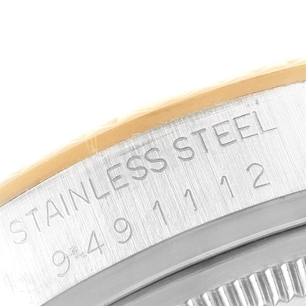 This image shows a close-up of the serial number engraving on the stainless steel case of a Rolex Datejust 16013 Men's Stainless Steel Champagne Dial 16013 Men's Stainless Steel Champagne Dial watch.