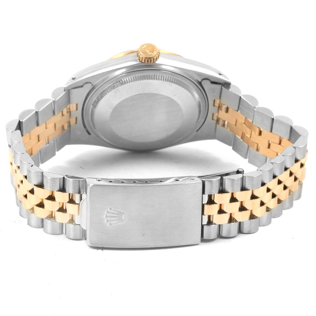 The image shows a rear view of a Rolex Datejust 16013 Men's Stainless Steel Champagne Dial 16013 Men's Stainless Steel Champagne Dial watch highlighting its case back, crown, and two-tone bracelet with clasp.