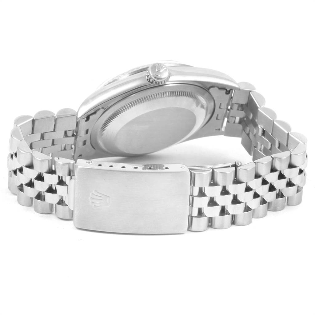 The image shows the back case, crown, and bracelet clasp of a Rolex Datejust 16234 Men's Stainless Steel Pink Dial 16234 Men's Stainless Steel Pink Dial watch at a slightly tilted top-down angle.