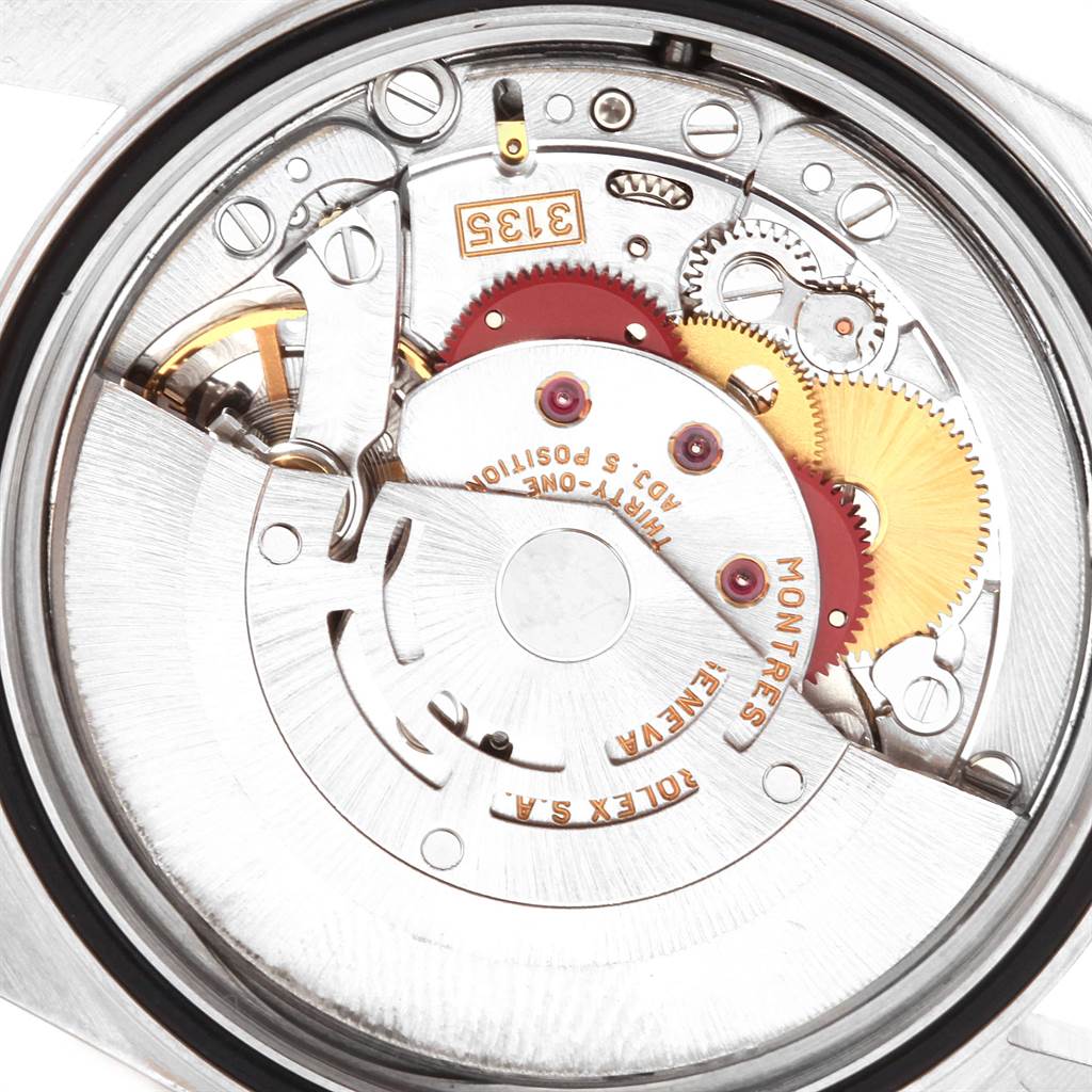 This image shows the internal movement mechanism of a Rolex Datejust 16234 Men's Stainless Steel Pink Dial 16234 Men's Stainless Steel Pink Dial watch viewed from the back.