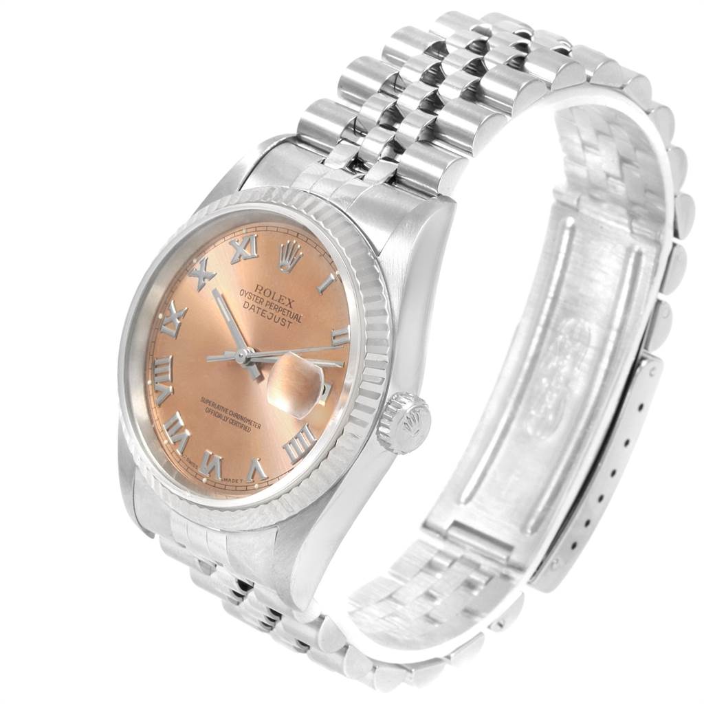 The image shows a Rolex Datejust 16234 Men's Stainless Steel Pink Dial 16234 Men's Stainless Steel Pink Dial watch from an angled side view, highlighting the case, dial, bracelet, and partially open clasp.