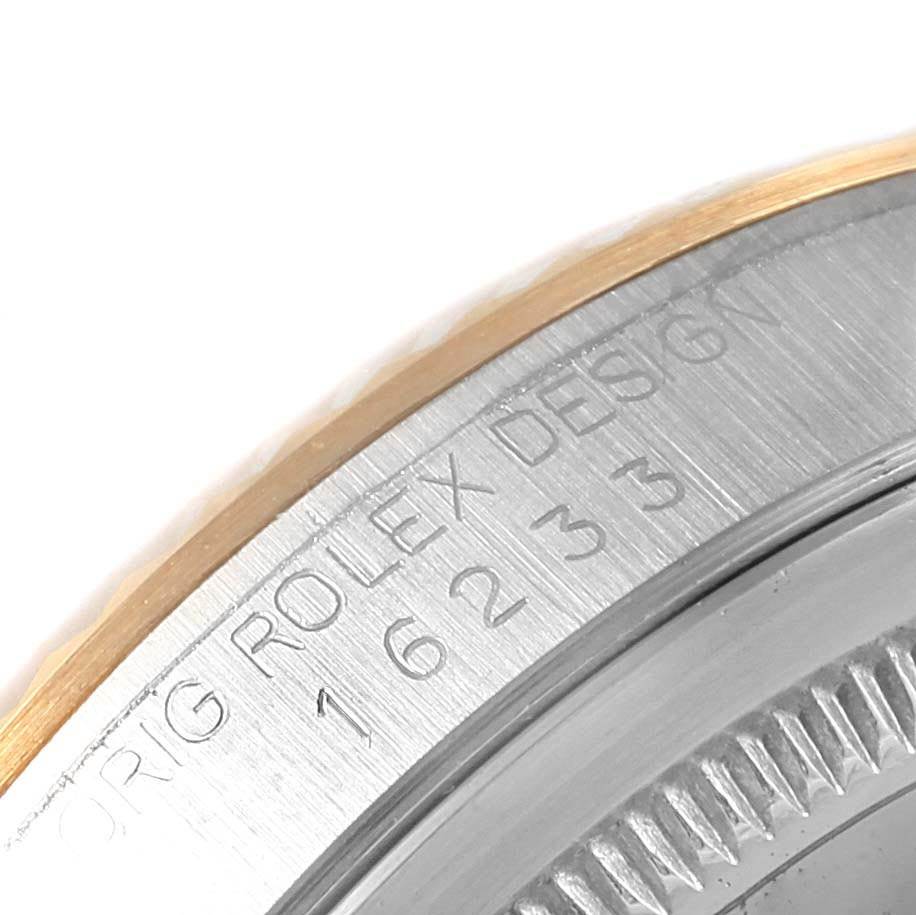 The image shows a close-up angle of a Rolex Datejust 16233 Men's Steel and Gold (two tone) Blue Dial 16233 Men's Steel and Gold (two tone) Blue Dial watch case back, highlighting the model number and "Orig Rolex Design" inscription.