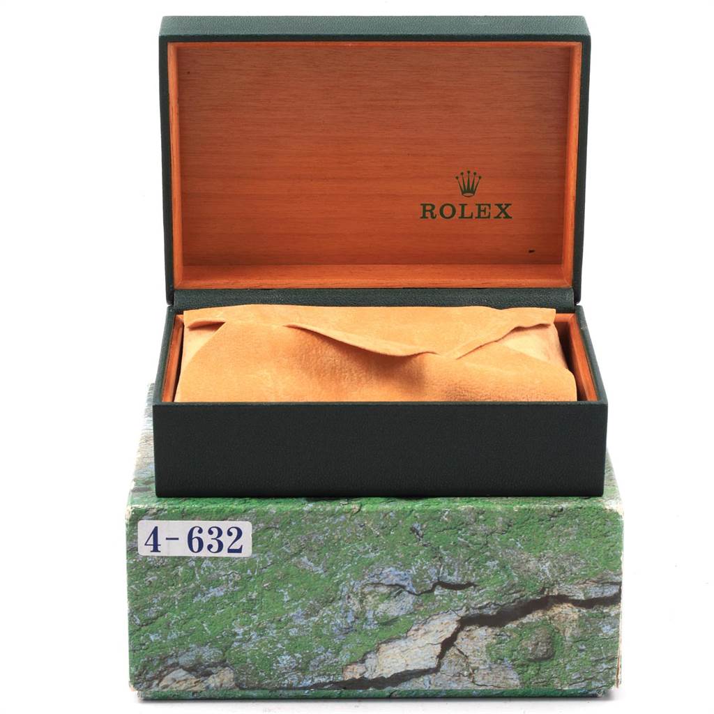 The image shows an open Rolex Datejust 16233 Men's Steel and Gold (two tone) Blue Dial 16233 Men's Steel and Gold (two tone) Blue Dial watch box with a soft covering, taken from the front.