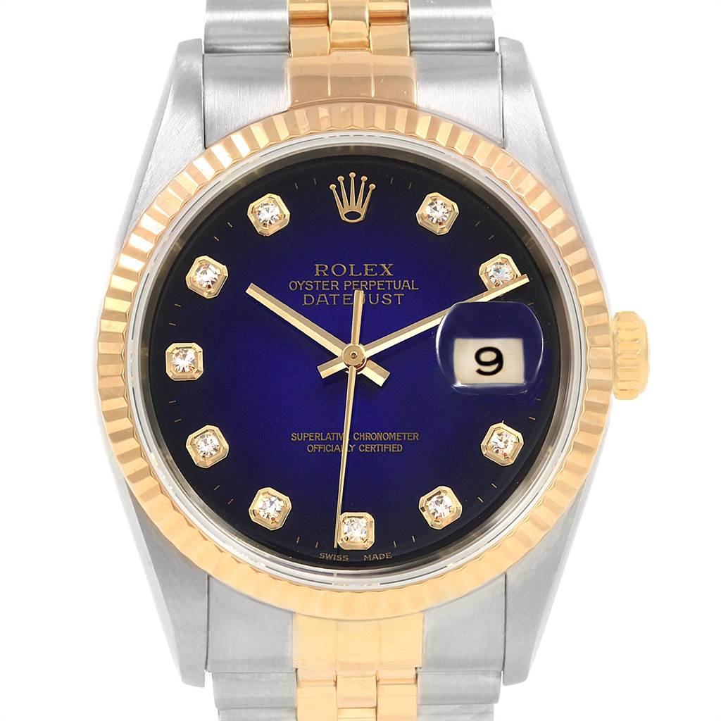 The image shows a front view of a Rolex Datejust 16233 Men's Steel and Gold (two tone) Blue Dial 16233 Men's Steel and Gold (two tone) Blue Dial watch, highlighting its blue dial, fluted bezel, and gold and silver bracelet.