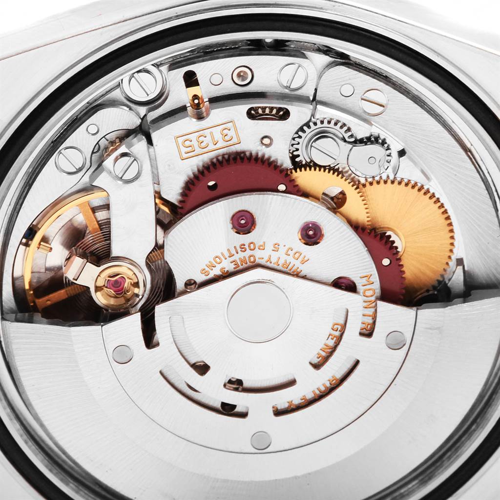 The image shows a close-up of the internal mechanism of a Rolex Datejust 16203 Men's Steel and Gold (two tone) Champagne Dial 16203 Men's Steel and Gold (two tone) Champagne Dial watch, featuring gears and components.