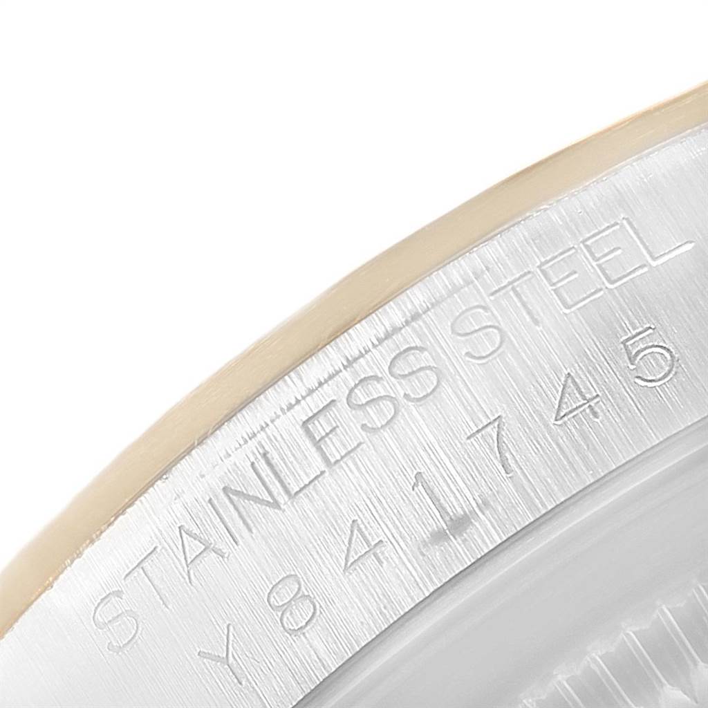 This close-up image shows the serial number and material engraving on the stainless steel bezel of a Rolex Datejust 16203 Men's Steel and Gold (two tone) Champagne Dial 16203 Men's Steel and Gold (two tone) Champagne Dial watch.