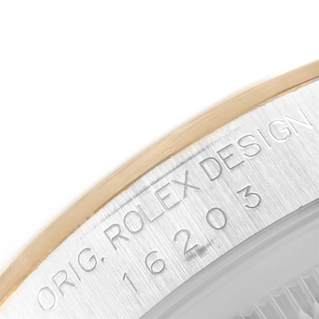 This is a close-up angle showing the engraved case side of a Rolex Datejust 16203 Men's Steel and Gold (two tone) Champagne Dial 16203 Men's Steel and Gold (two tone) Champagne Dial watch, highlighting the original design number.