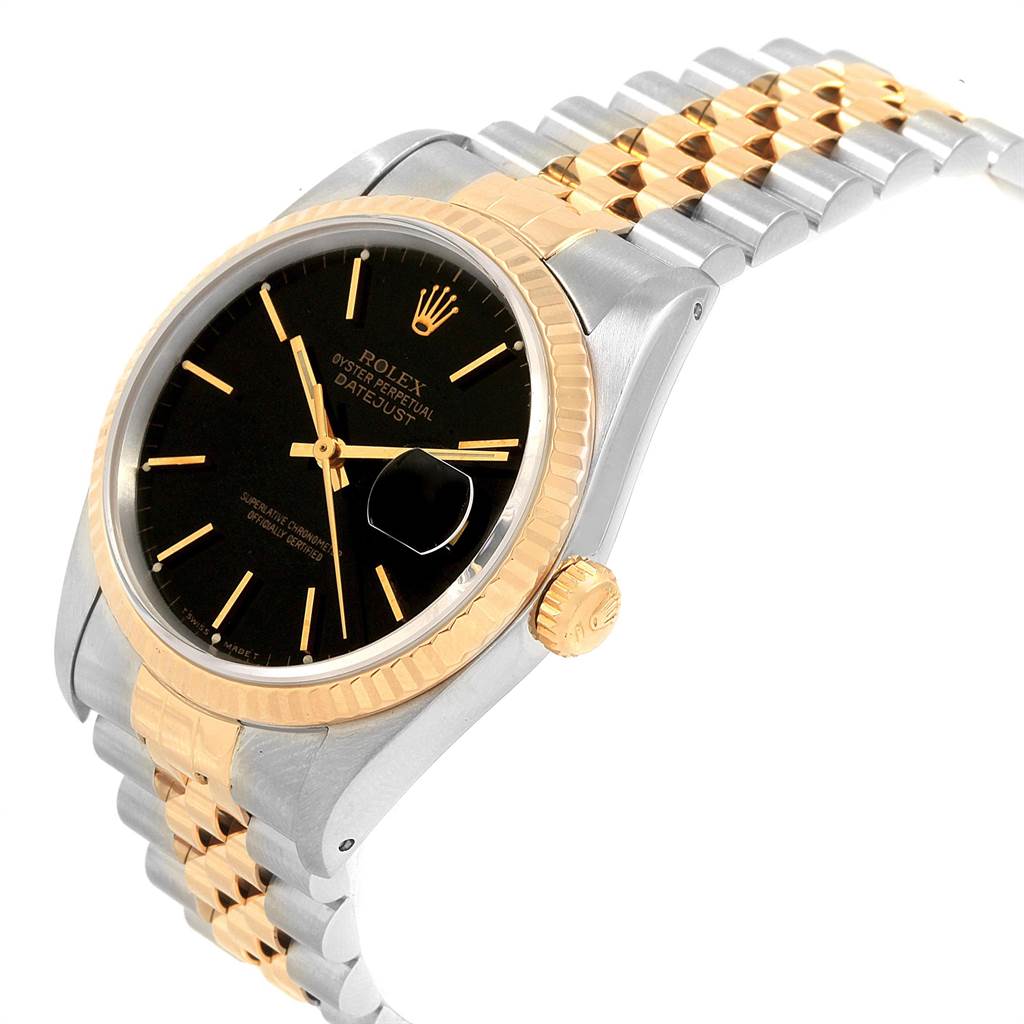 This image shows a side view of a Rolex Datejust 16233 Men's Steel and Gold (two tone) Black Dial 16233 Men's Steel and Gold (two tone) Black Dial watch, highlighting its black dial, gold bezel, and two-tone bracelet.
