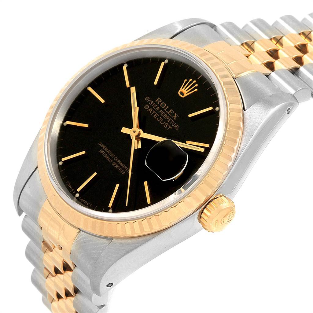 The image shows a Rolex Datejust 16233 Men's Steel and Gold (two tone) Black Dial 16233 Men's Steel and Gold (two tone) Black Dial watch at a slight angle, featuring its black dial, gold fluted bezel, and jubilee bracelet.