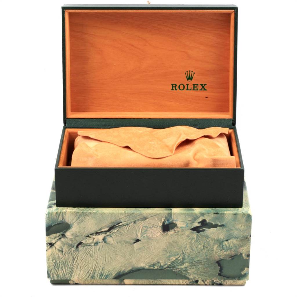 This image shows an open Rolex box for the Datejust model, with a fabric cloth inside.