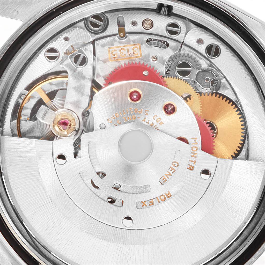 The image shows the intricate internal mechanics of a Rolex Datejust 16234 Men
s Stainless Steel White Dial 16234 Men
s Stainless Steel White Dial watch from a close-up angle.