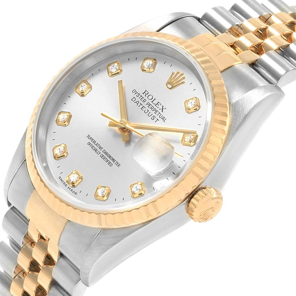 This image shows a close-up angle of the Rolex Datejust 16233 Men's Steel and Gold (two tone) Silver Dial 16233 Men's Steel and Gold (two tone) Silver Dial watch, highlighting its dial, bezel, crown, and two-tone bracelet.