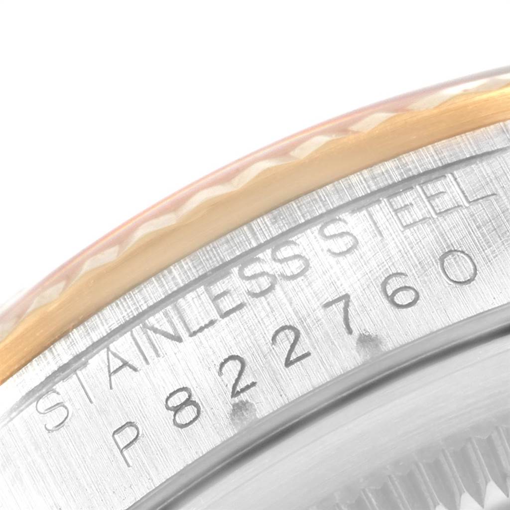 This close-up image shows the side view of the bezel and part of the case with the serial number engraving on a Rolex Datejust 16233 Men's Steel and Gold (two tone) Silver Dial 16233 Men's Steel and Gold (two tone) Silver Dial watch.