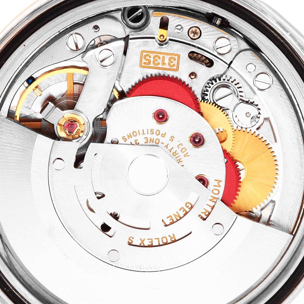 This image shows an up-close view of the movement mechanism of a Rolex Datejust 16233 Men's Steel and Gold (two tone) Silver Dial 16233 Men's Steel and Gold (two tone) Silver Dial watch.