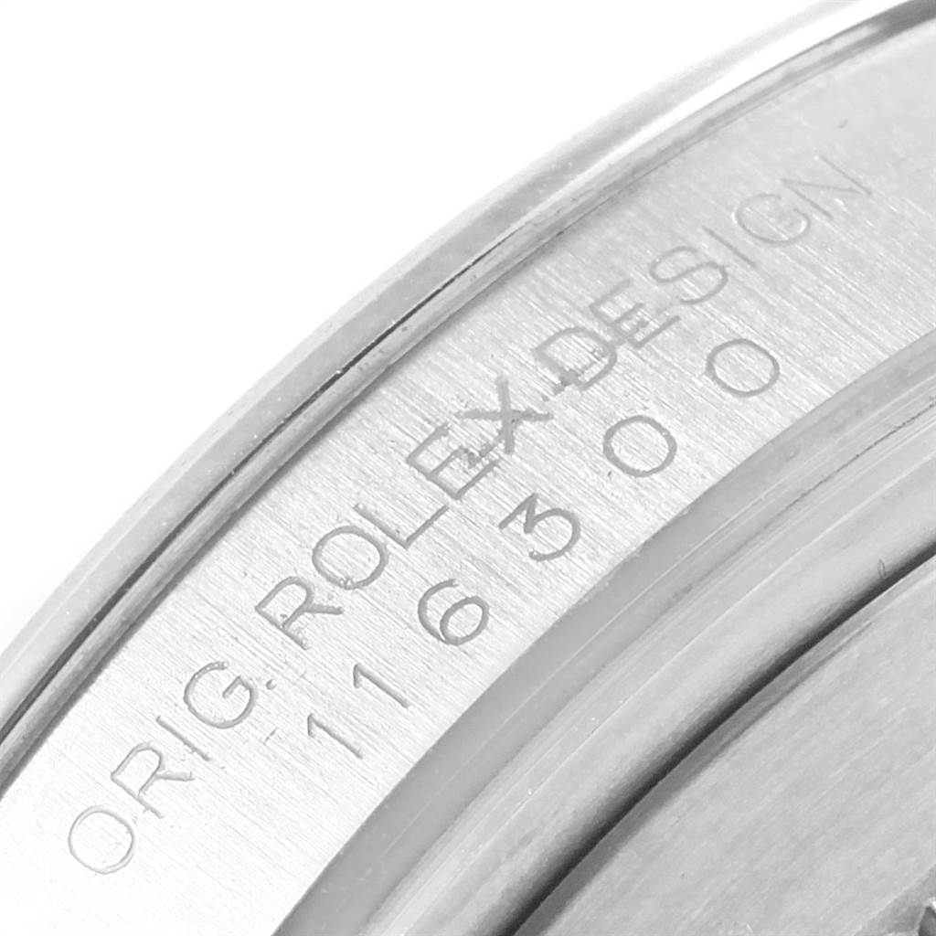 The image shows a close-up of the serial number engraved on the case of a Datejust model by Rolex.