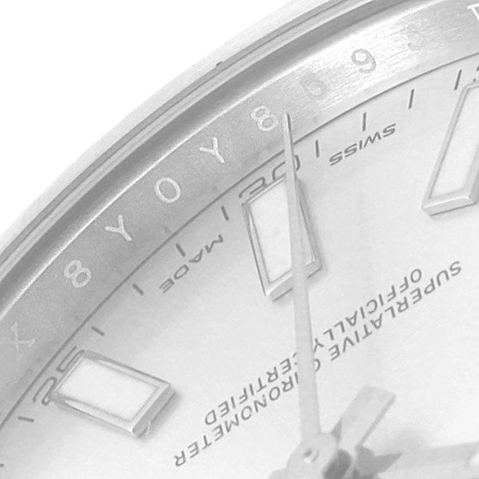 This close-up image shows the dial, including the hour markers and hands, of a Rolex Datejust 116300 Men
s Stainless Steel Silver Dial 116300 Men
s Stainless Steel Silver Dial watch.