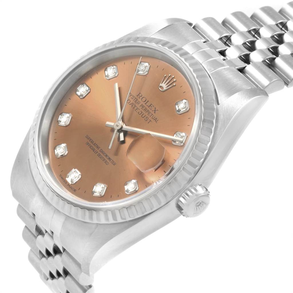 This image shows a Rolex Datejust 16234 Men
s Stainless Steel Pink Dial 16234 Men
s Stainless Steel Pink Dial watch with a diamond-set dial, cyclops lens over the date, and a jubilee bracelet from an angled side view.
