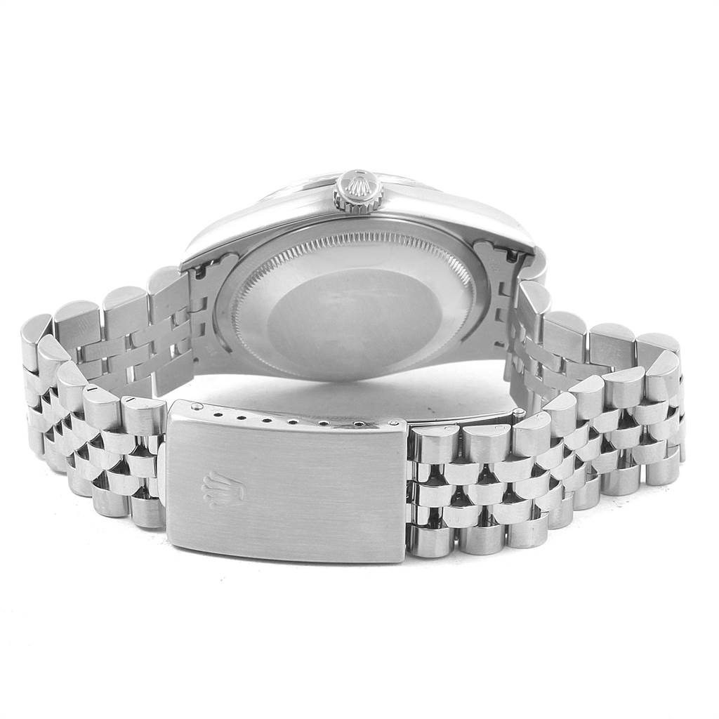 This image shows the backside of a Rolex Datejust 16234 Men
s Stainless Steel Pink Dial 16234 Men
s Stainless Steel Pink Dial watch, highlighting its case back and Jubilee bracelet clasp.