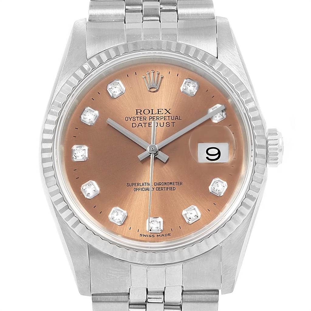 The image shows a close-up of the face and bezel of a Rolex Datejust 16234 Men
s Stainless Steel Pink Dial 16234 Men
s Stainless Steel Pink Dial watch.