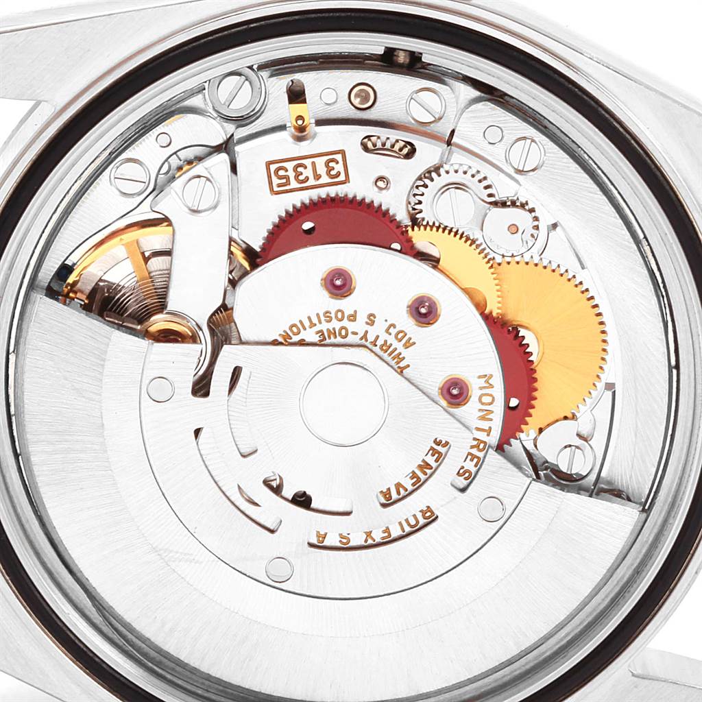 This image shows the internal movement components of a Rolex Datejust 16234 Men
s Stainless Steel Pink Dial 16234 Men
s Stainless Steel Pink Dial watch viewed from the back.