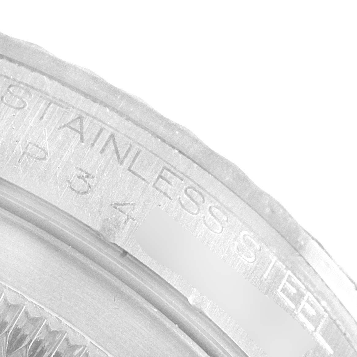 The image shows an up-close view of the case edge and part of the bezel of a Rolex Datejust 16234 Men's Stainless Steel Mother of Pearl Dial 16234 Men's Stainless Steel Mother of Pearl Dial with "STAINLESS STEEL" text visible.