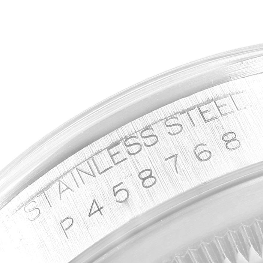 This image captures a close-up of the Rolex Datejust 16200 Men's Stainless Steel White Dial 16200 Men's Stainless Steel White Dial watch's stainless steel case with visible serial engraving.