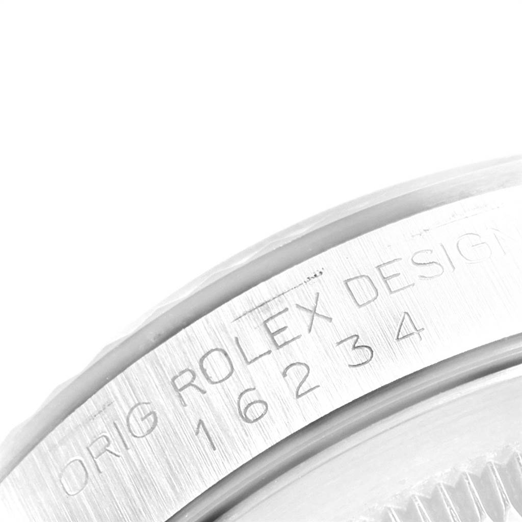 Close-up of the case side of a Rolex Datejust 16234 Men
s Stainless Steel Silver Dial 16234 Men
s Stainless Steel Silver Dial, showing the model number and "Orig Rolex Design" engraving.