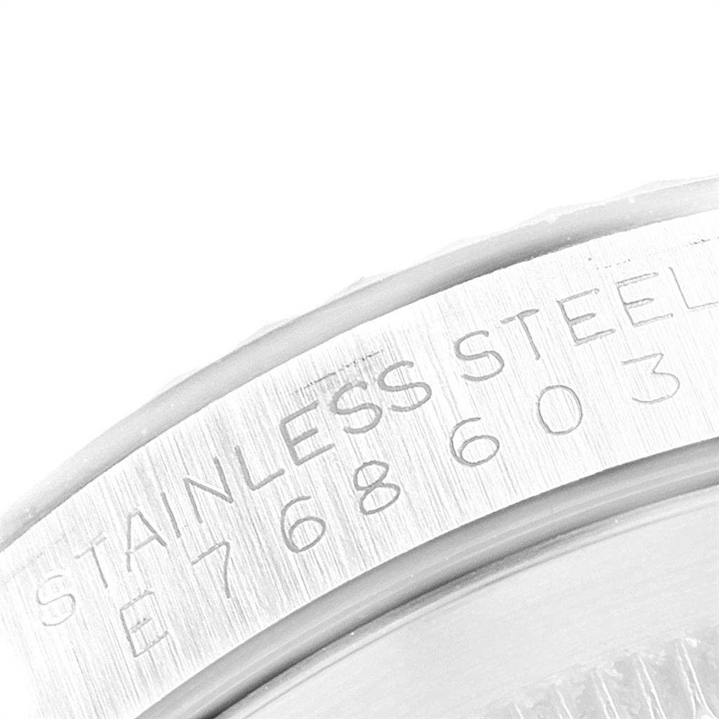 This is a close-up angle of the side of the case of a Rolex Datejust 16234 Men
s Stainless Steel Silver Dial 16234 Men
s Stainless Steel Silver Dial model, showing the stainless steel engraving and serial number.