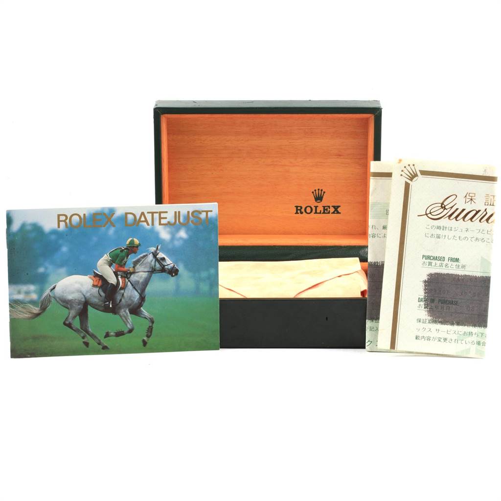 The image shows a Rolex Datejust 16234 Men
s Stainless Steel Silver Dial 16234 Men
s Stainless Steel Silver Dial watch box with accompanying booklets and warranty papers.