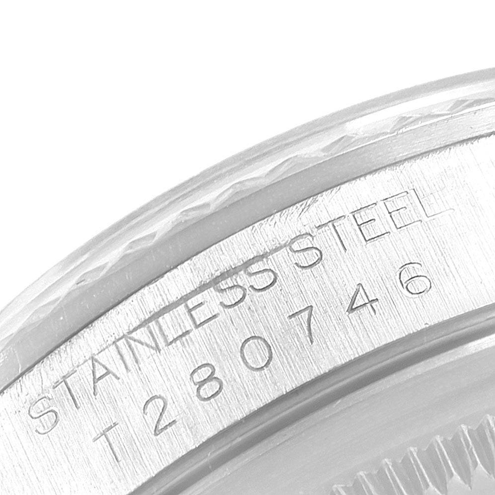 The image shows a close-up of the serial number and "STAINLESS STEEL" engraving on a Rolex Datejust 16234 Men
s Stainless Steel Silver Dial 16234 Men
s Stainless Steel Silver Dial watch.