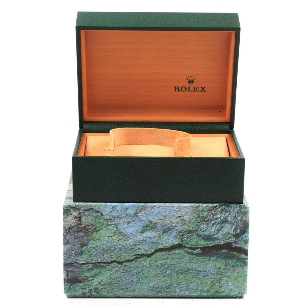 This image shows an open green Rolex Datejust 16234 Men
s Stainless Steel Silver Dial 16234 Men
s Stainless Steel Silver Dial watch box with no watch inside, displaying the interior and cushioning.