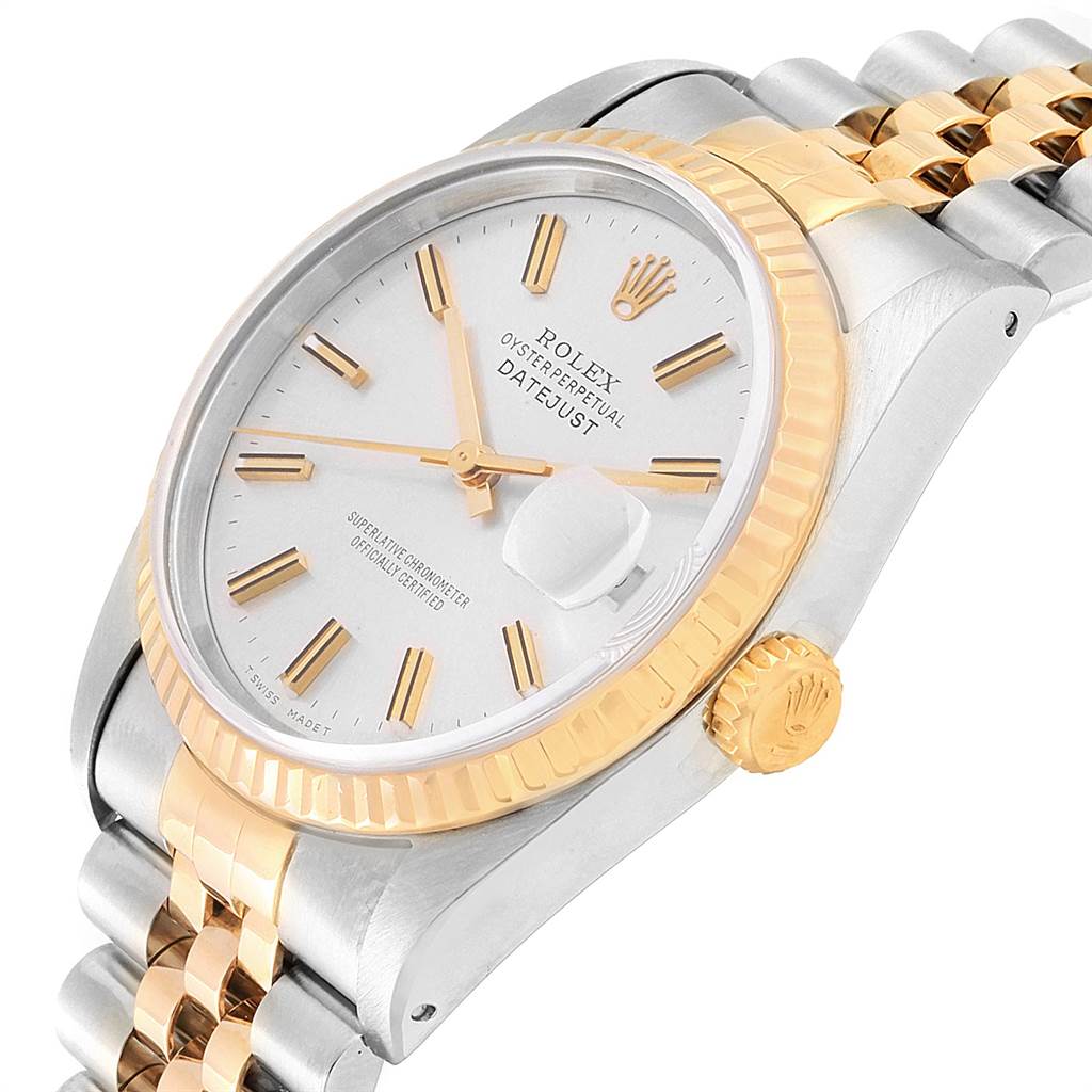 The image shows a close-up angle of a Rolex Datejust 16233 Men's Steel and Gold (two tone) Silver Dial 16233 Men's Steel and Gold (two tone) Silver Dial watch, featuring the dial, crown, bezel, and part of the bracelet.