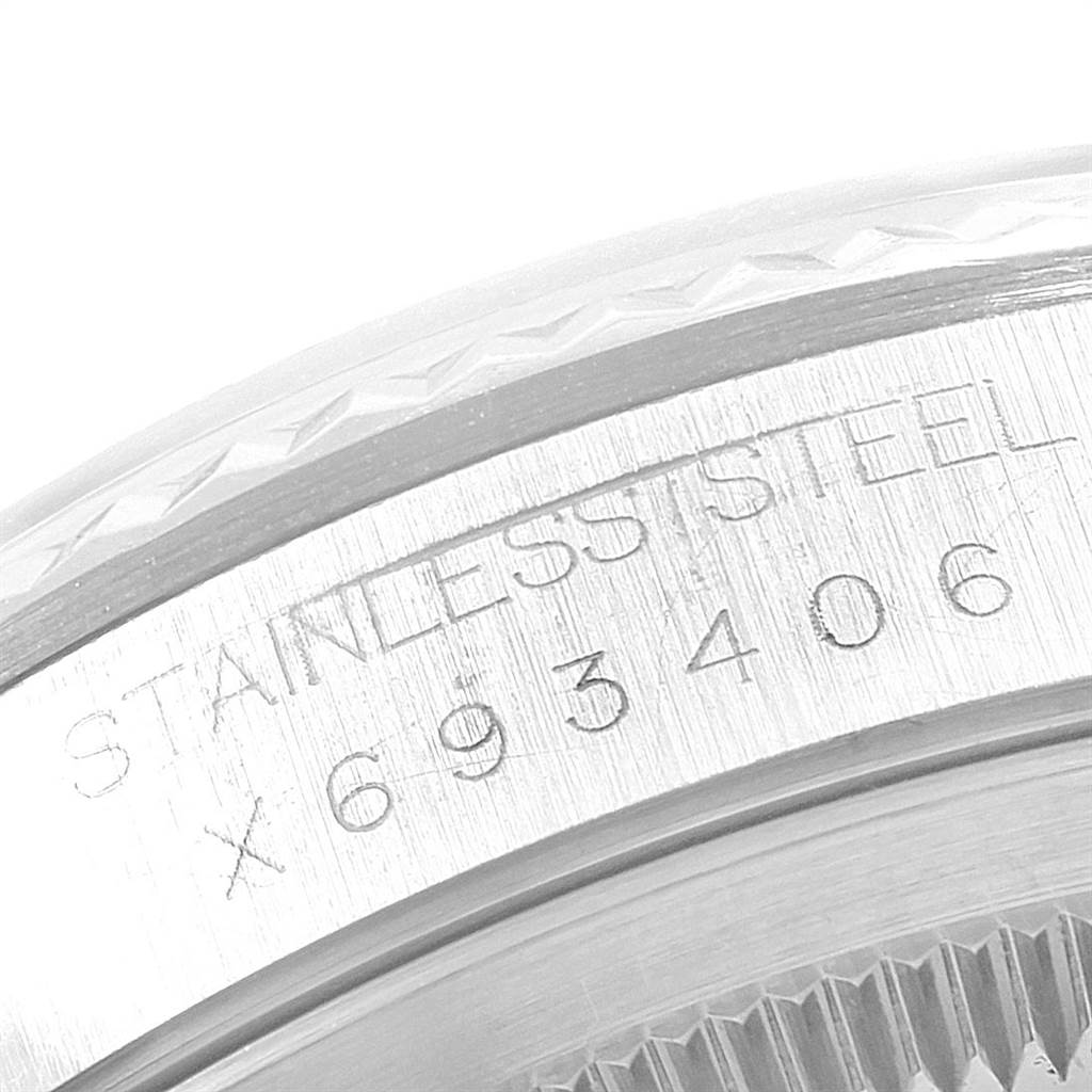 This close-up image shows the engraving on the stainless steel bezel of a Rolex Datejust 16234 Men's Stainless Steel Silver Dial 16234 Men's Stainless Steel Silver Dial watch.