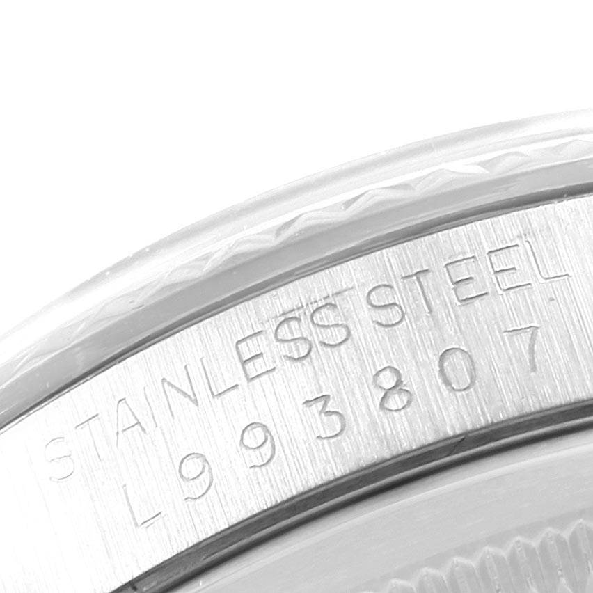 The image shows a close-up of the serial number and "STAINLESS STEEL" engraving on the inner bezel of a Rolex Datejust 16234 Men's Stainless Steel Grey Dial 16234 Men's Stainless Steel Grey Dial watch.