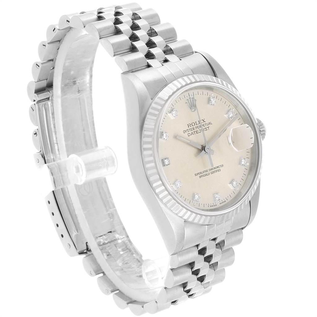 The Rolex Datejust 16234 Men's Stainless Steel Silver Dial 16234 Men's Stainless Steel Silver Dial watch is shown at an angle highlighting the dial, fluted bezel, and part of the jubilee bracelet.